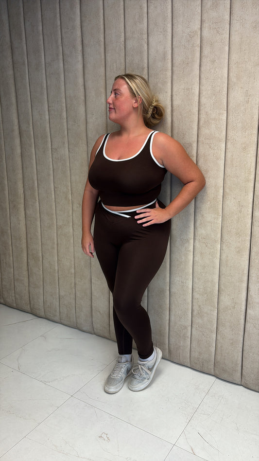 Brown gym set with white piping