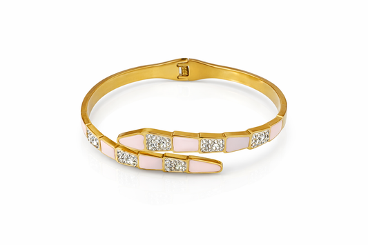 Gold bracelet with a pink and white design